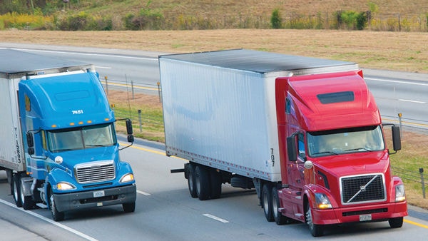 two trucks driving